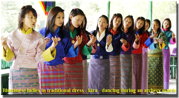 Bhutanese ladies in traditional dress - kira - dancing during an archery match